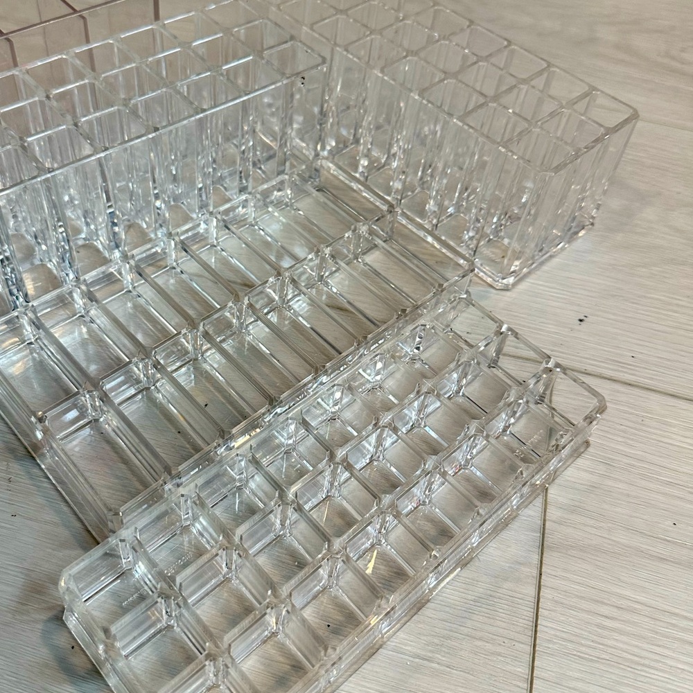 Four acrylic makeup holders